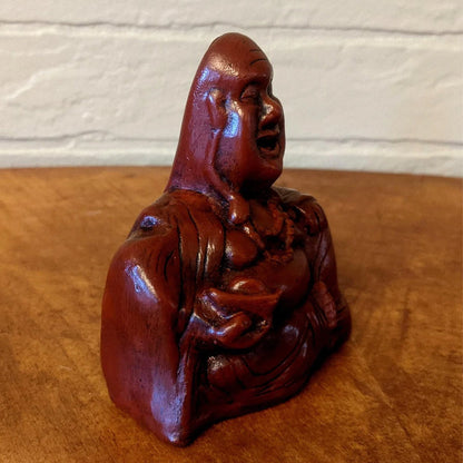 Dekoration med Buddha och utsträckt långfinger