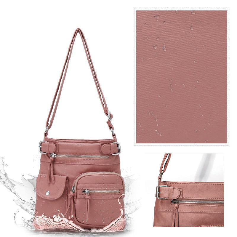 Mjuk crossbody-väska med flera fickor