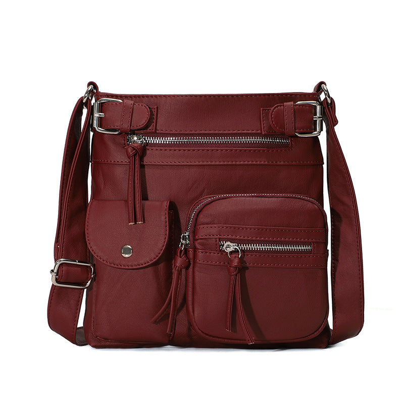 Mjuk crossbody-väska med flera fickor